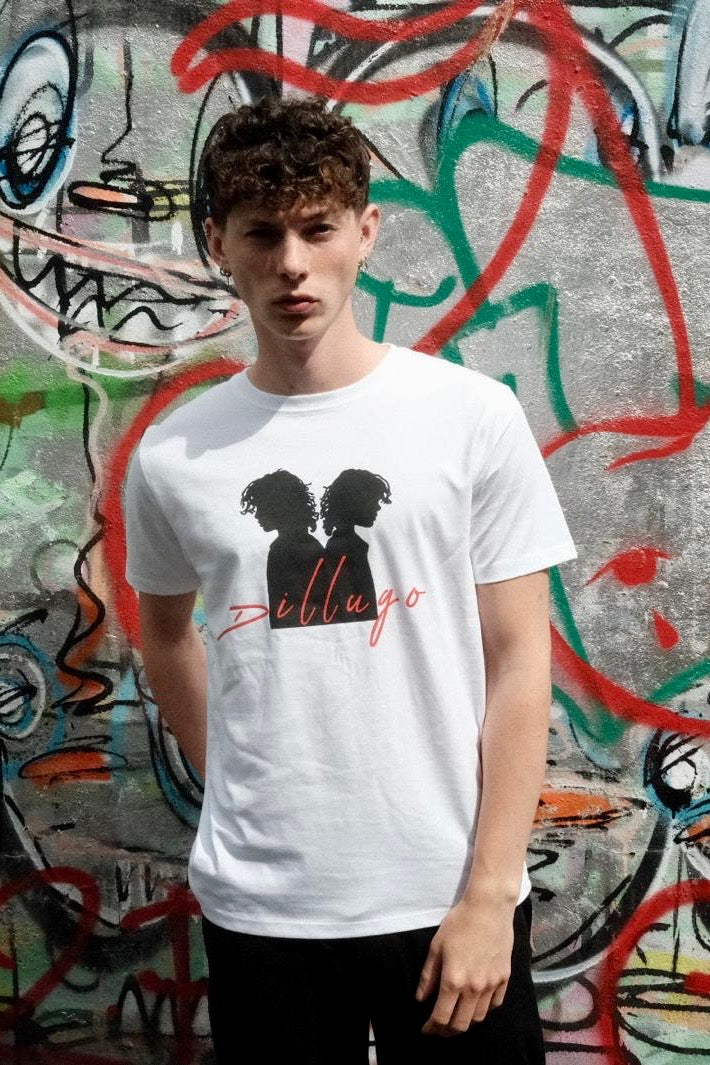 Male model wearing white t-shirt with "Dillugo" written across it (in red) and the signature Dillugo silhouette, on a graffiti backdrop.